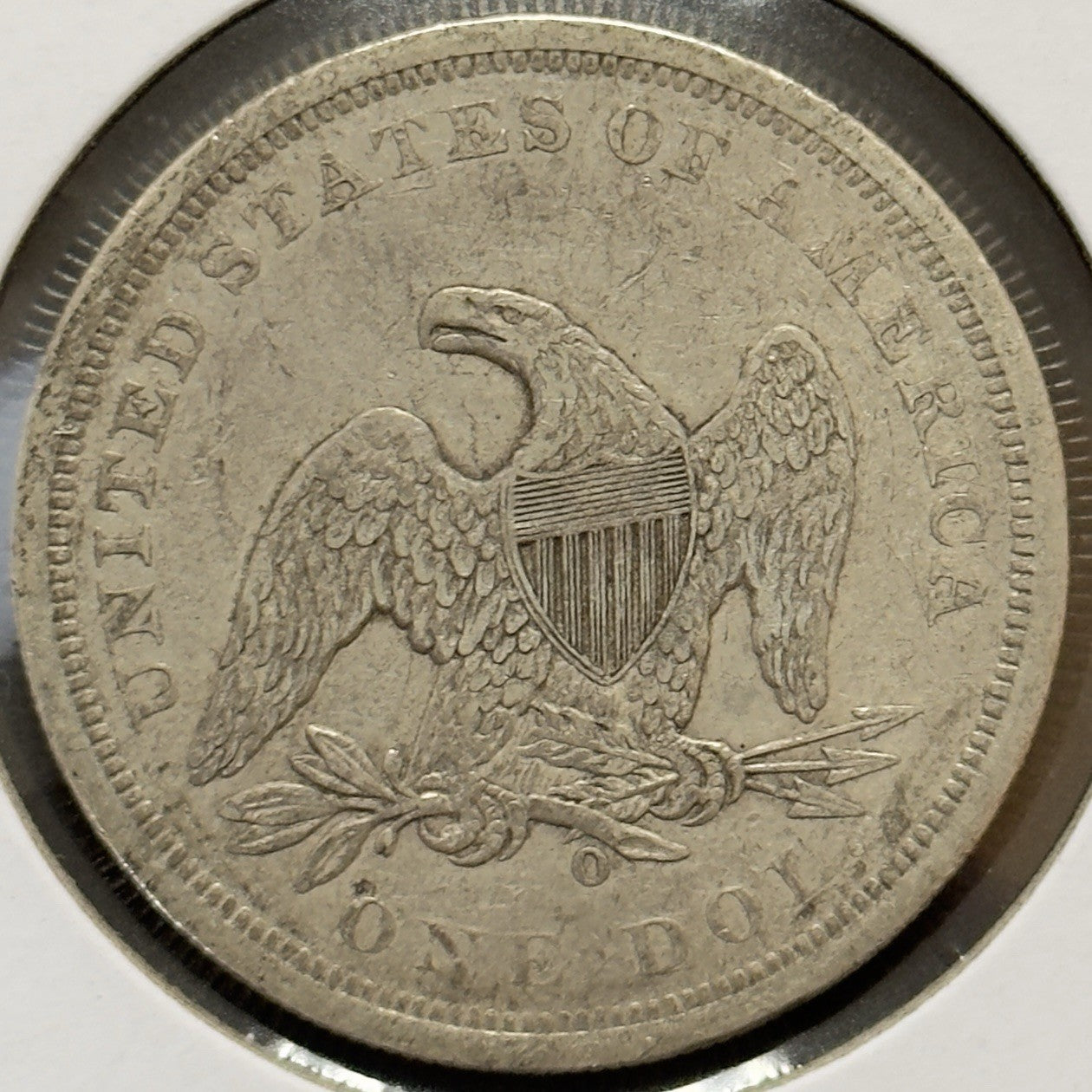 1860 O Seated Dollar - Extra Fine *Crackout* ( 40502 )