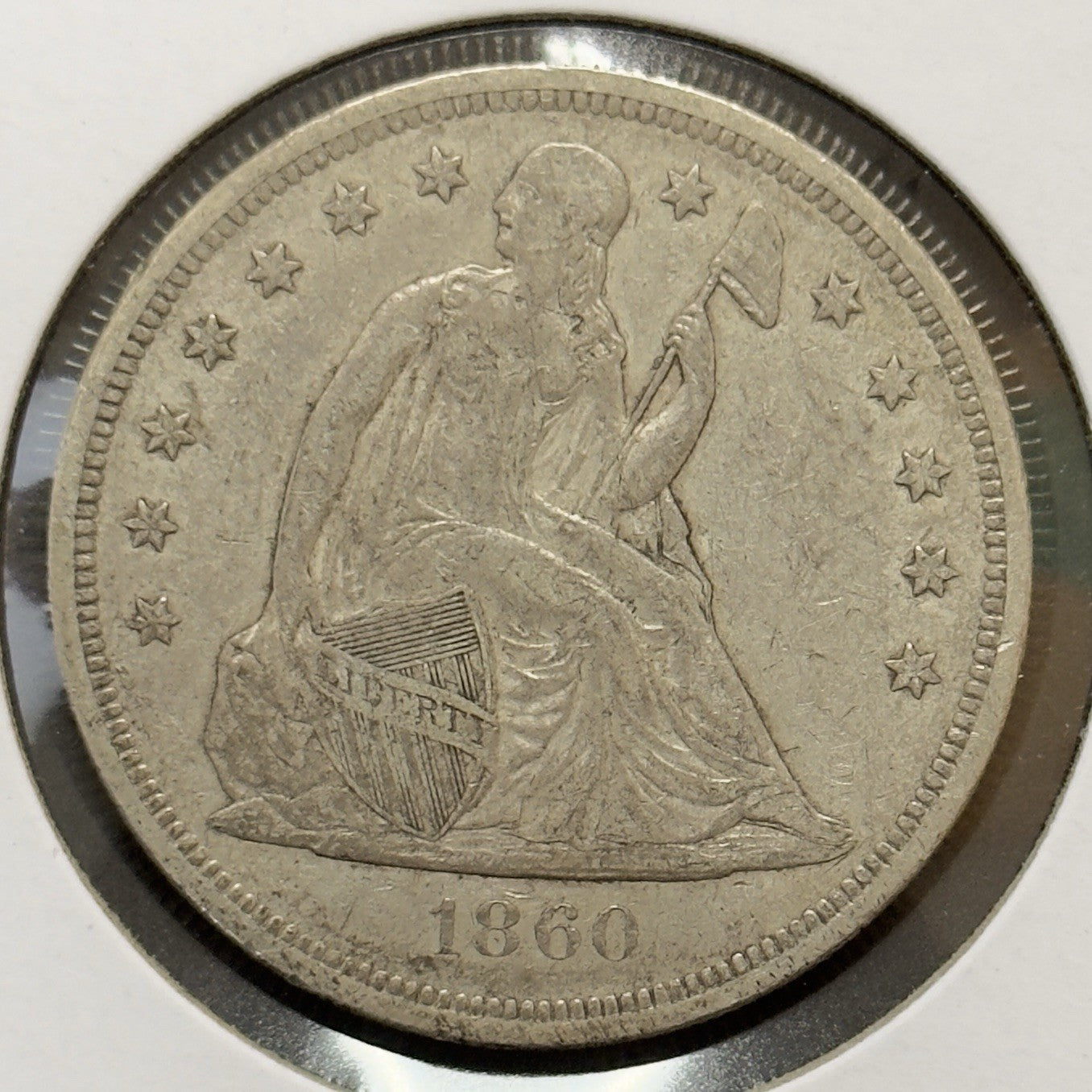 1860 O Seated Dollar - Extra Fine *Crackout* ( 40502 )