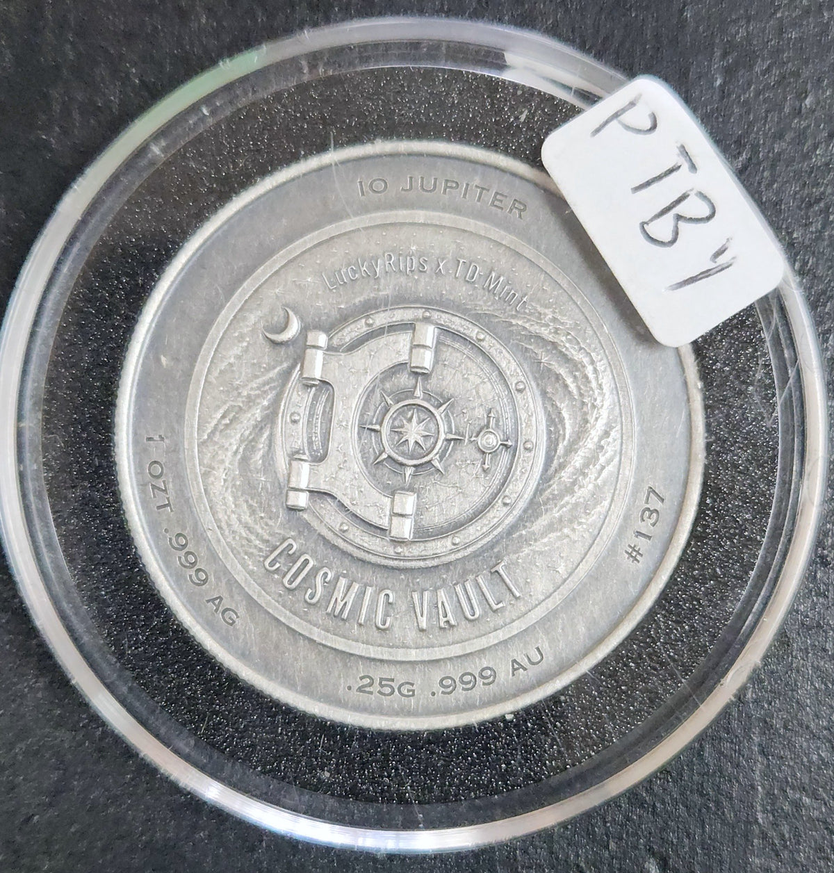 LuckyRips × TD Mint Cosmic Vault – Io Jupiter – 1 Oz.999 Silver With.25g.999 Gold – #137 PTBY — Reverse