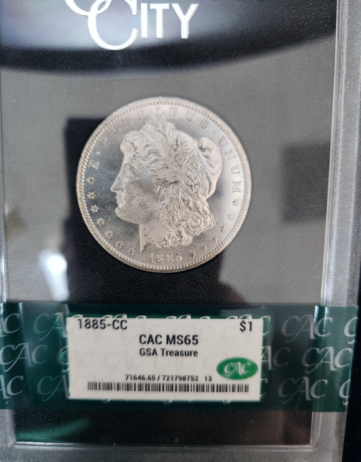 1885-CC Morgan Dollar $1 CAC MS65 GSA Treasure 71646.65-72179875213 — Edge